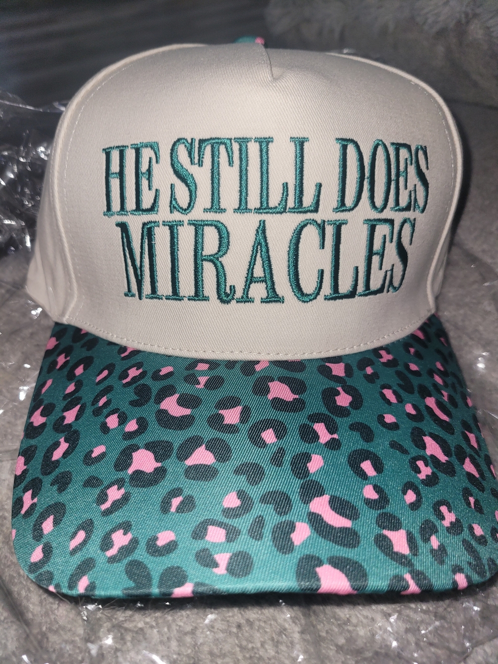 'He Still Does Miracles' Embroidered Cap with Teal & Pink Leopard Visor